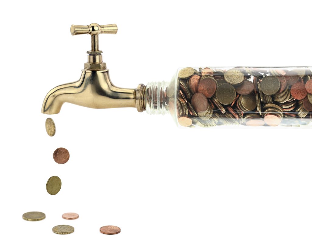 Money coins fall out of the golden tap